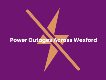 Purple square with a yellow lightening bolt icon in the centre with a line through it that reads Power Outages Across Wexford
